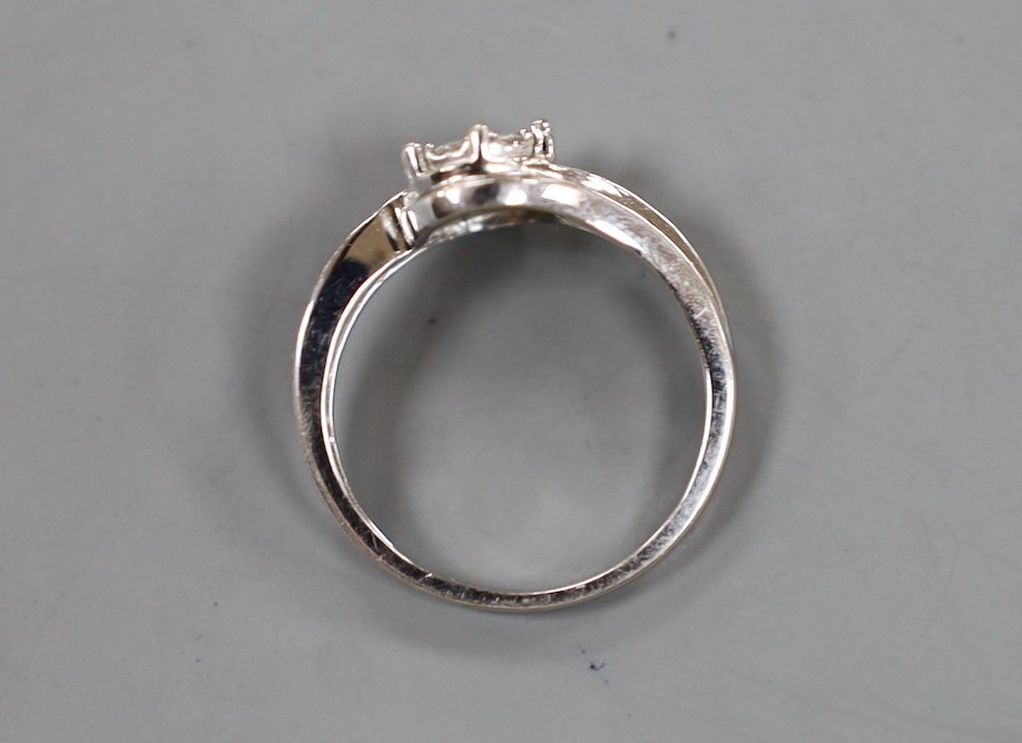 A modern 18kt white metal and diamond cluster set ring, size P, gross weight 3.8 grams.